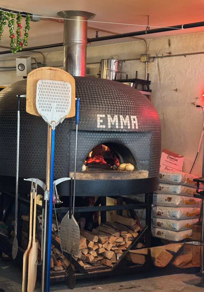 A tiled, wood-fired pizza oven.