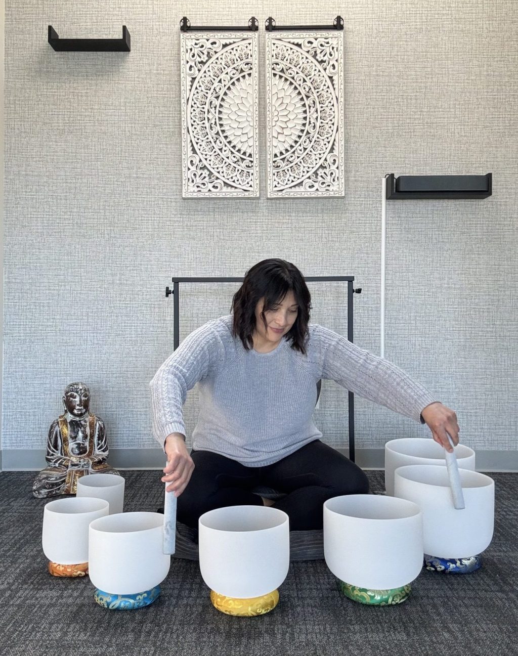 Mirtha Lopez, a spiritual healing practitioner, demonstrating a south bath.