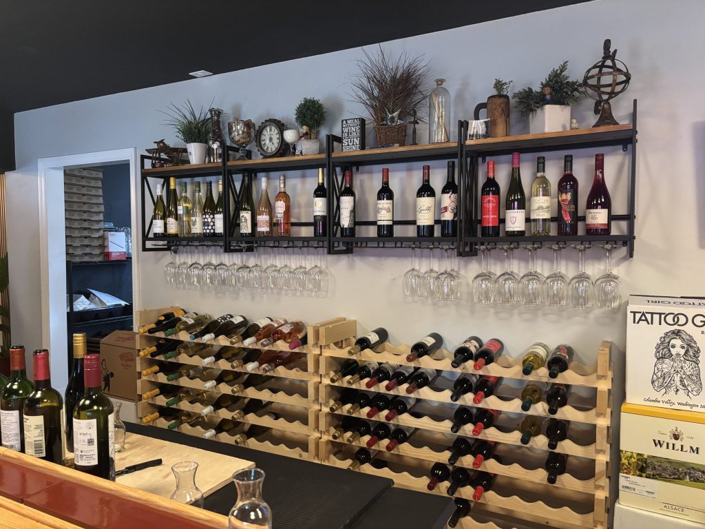 A wine rack with bottles of wine.